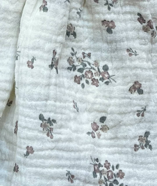 Detailansicht festliches Musselin Babykleid